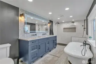 Master bath with quart's countertops, Kingston Brass & Moen fixtures, cast iron tub, dimmable anti-fog mirror and tile floors & extensive tile work behind mirror, tub and in shower