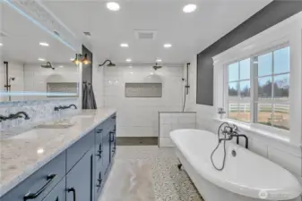 Master bath with quart's countertops, Kingston Brass & Moen fixtures, cast iron tub, dimmable anti-fog mirror and tile floors & extensive tile work behind mirror, tub and in shower