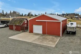 Huge 32x42 shop. Heated floors with access through a man door, automatic garage door and large sliding door. 30-amp RV Hookup. Dog Kennel between shop and root cellar.