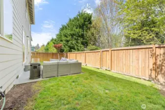 Private yard backing up to green space.