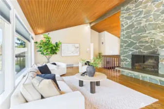 Vaulted ceiling with fireplace in living room