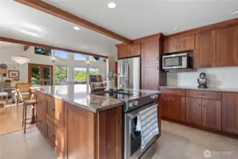 Featuring sleek stainless steel appliances and abundant counter space, this modern kitchen is designed for both everyday living and gourmet cooking.