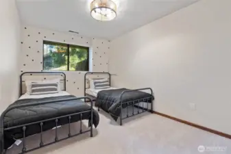 Bedroom three is situated downstairs, providing a secluded and peaceful retreat.