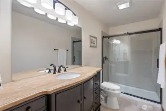 The third full bathroom, located on the lower level, features a full-size shower and ample counter space for added convenience.
