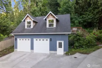 A double car garage with ample storage and studio awaits your toys and hobbies!