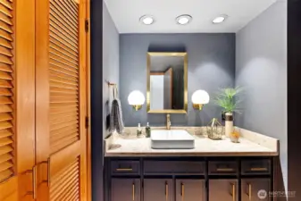 Powder room off the living room, continuing the 70s vibe.