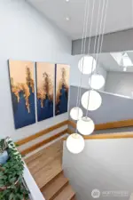 Another nod to the 70s is this chandelier, which seems to have been designed for the stairway leading to the primary suite.
