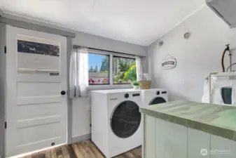 Large laundry room with new washer/dryer.