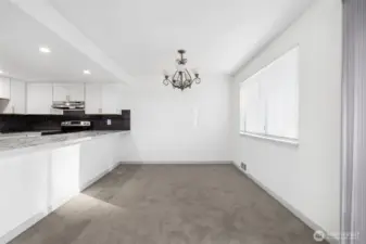 Dine in style with a view of the updated kitchen. New cabinets and appliances are ready for you.
