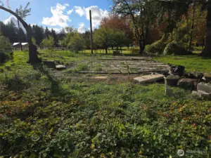 Former location of double wide manufacturered home and septic tank location at the front.