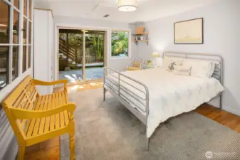 The second bedroom on the lower level has slider doors to the side patio.