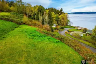 more aerial view looking to north end of lot with view of community picnic area and beach to the right