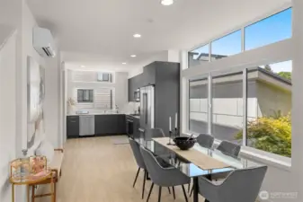 Gourmet kitchen anchored by sleek cabinetry and expansive countertops is designed for inspired cooking.