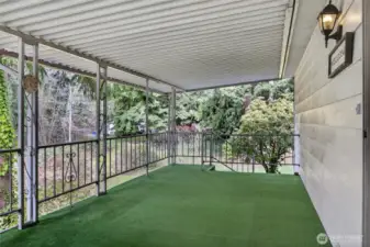 The large deck has access from the carport and also takes you to the backyard.