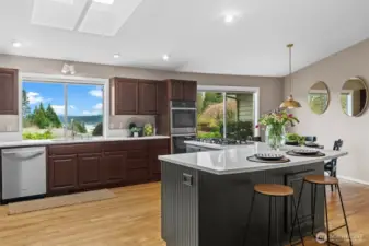 Chef's kitchen with gas range and updates appliances