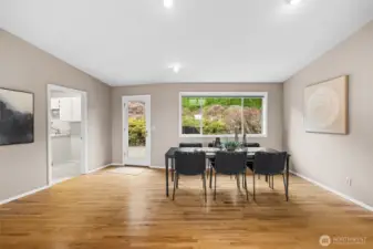 Door on the left leads to laundry area, 1/2 bath, second office space and garage