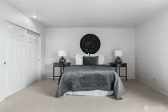 Can easily fit a king sized bed with plenty of extra space