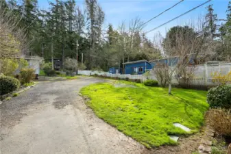 Long driveway with lots of parking and yard