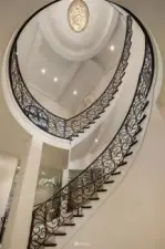 Grand staircase with custom-forged ironwork