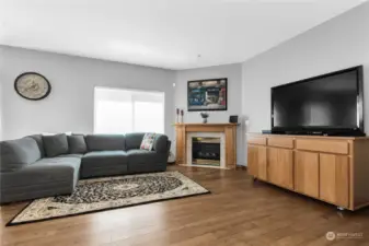 Family room, light and bright. also, new hardwood floors!