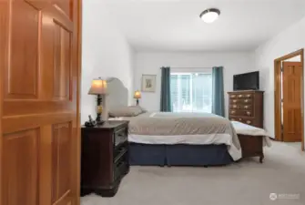 French doors lead to the primary bedroom on the main floor.