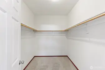 Large walk-in closet in primary suite.