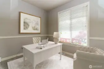 From the entry way, walk into your private office w/ glass French doors & chair railing.