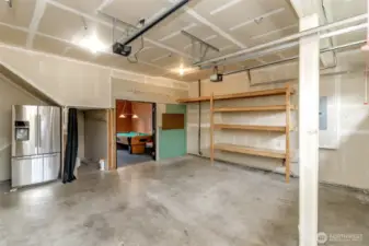 Plenty of space for storage and a workbench. BOTH garage door openers are NEW. Additional fridge stays. Enjoy your private man cave off the garage.