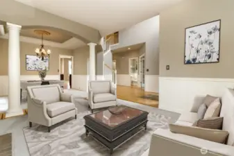 Another view  of the formal living looking into dining room which  displays double coffered ceiling & take a look at the majestic columns.