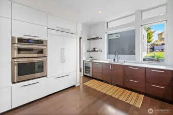 Kitchen showing the integrated JennAir french-door refrigerator and wall oven/microwave