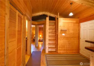 Front entry and step/ladder to storage or could be loft sleeping area.