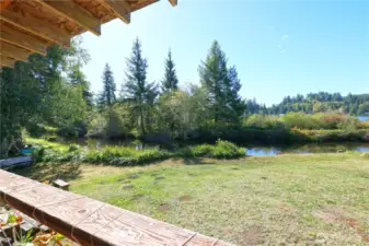 View from the deck onto small canal entering into the lake.