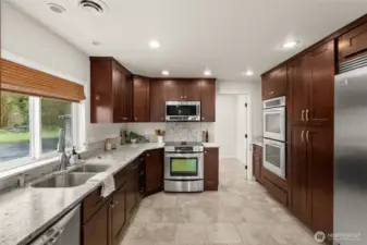 Double oven, range oven, Double Dishwasher, and Double Fridge. Cupboard pull outs and plenty of counter top space.