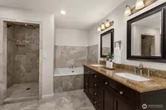 Second Primary Suite walk in shower, tub and double vanity.