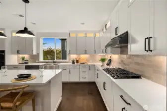 Kitchen Detail: Modern kitchen features a sleek gas cooktop with designer tile backsplash, abundant cabinetry, and quartz counters. Expansive prep space and high-end finishes create a stylish hub for culinary creativity.    Photos are from the model home at Foxmoore and for visualization purposes only. Plans, colors, building orientation, finishes, home outlook, and other details can and WILL vary.