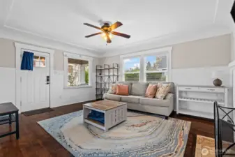 Bright & Inviting Living Room with Hardwood Floors and Classic Wainscoting