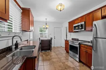 Well-Appointed Kitchen with Granite Countertops and Stainless Steel Appliances
