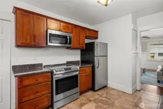 Updated Kitchen with Stainless Steel Appliances and Rich Wood Cabinetry
