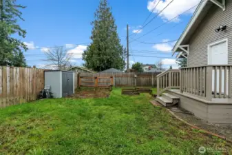 Fully Fenced Backyard with Storage Shed and Deck Access