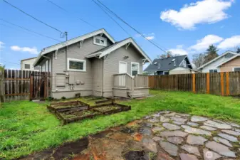 Craftsman Bungalow with Gardener's Backyard and Stone Pathway