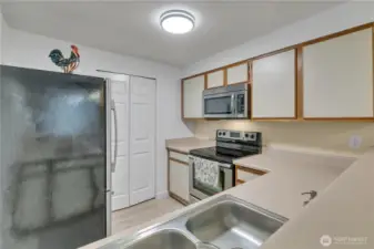 In-unit washer and dryer behind the folding doors in the center