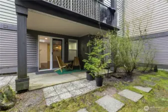 Ground floor unit with private patio--soon to be surrounded by blooming greenery