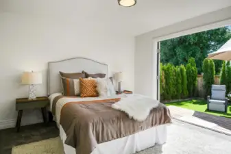 This lovely primary bedroom has French doors that open up to your backyard oasis making this your own personal retreat space.