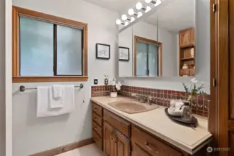 Main level bathroom includes extra built-ins