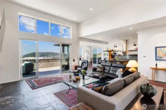 Open concept space plan from living room to kitchen and dining area.