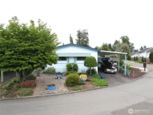 1,100+ Sq Ft, 2 Bedroom /2 Bath with covered parking, covered deck and raised garden beds. Dog park and other open space surround the home.