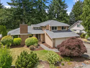 Welcome to 12610 Vine Maple Drive SW in Lakewood. This home is situated on a large corner lot with mature landscaping.