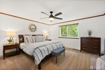 The abundant primary suite has a double door entry, large window overlooking the gorgeous backyard, an ensuite private bath and two large closets.