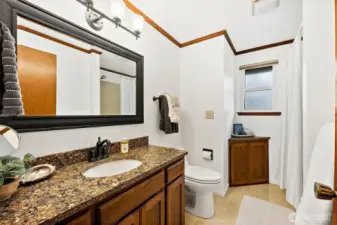 The upstairs hall bathroom also has granite counters and a tub/shower combination.