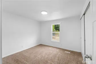 This is the back bedroom which could also be a primary being it's beside the bathroom, but you have options!